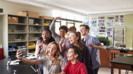 Group Of High School Students Taking Selfie In Biology Classroom